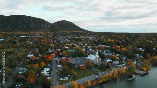 aerial circular shot revealing Mont Saint Hilaire landscape and town in Quebec province near Montreal City during fall season in Canada photo