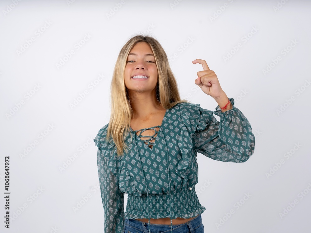 caucasian teen girl wearing green dress over white pointing up with fingers number nine in Chinese sign language Jiu caucasian teen girl wearing green dress over white pointing up with fingers number nine in Chinese sign language Jiu