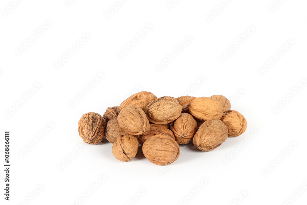 Several whole walnuts on a white background Several whole walnuts on a white background