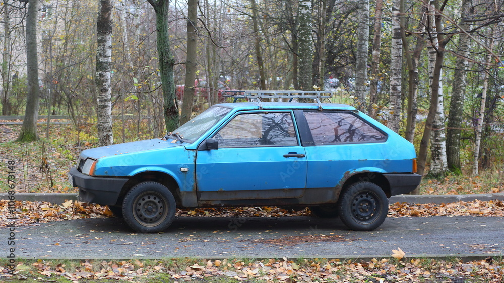 An old rusty light blue car is parked on the road., Iskrovsky Prospekt, Saint Petersburg, Russia, November 07, 2024 An old rusty light blue car is parked on the road., Iskrovsky Prospekt, Saint Petersburg, Russia, November 07, 2024