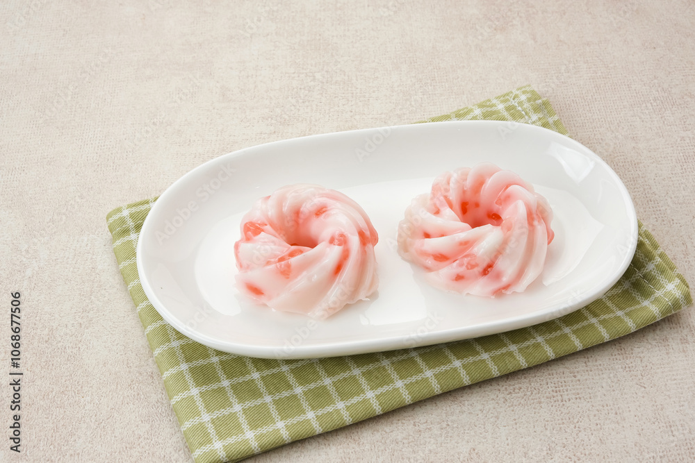 Kue Jentik Manis, Indonesian traditional snack made from hunkwe flour, sago pearl, and coconut milk.
Kue Jentik Manis, Indonesian traditional snack made from hunkwe flour, sago pearl, and coconut milk.