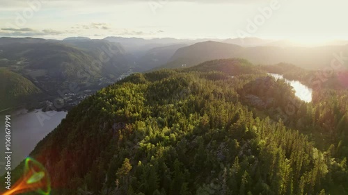 Scenic River Flowing Through Verdant Mountains Under Bright Sun