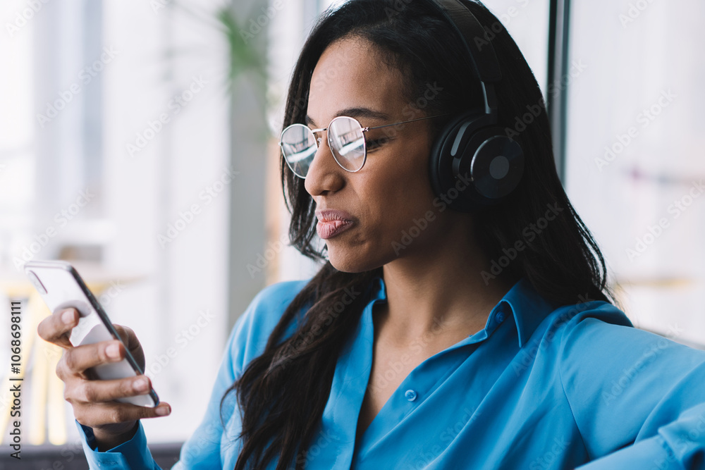 Glad black woman using smartphone at work Glad black woman using smartphone at work