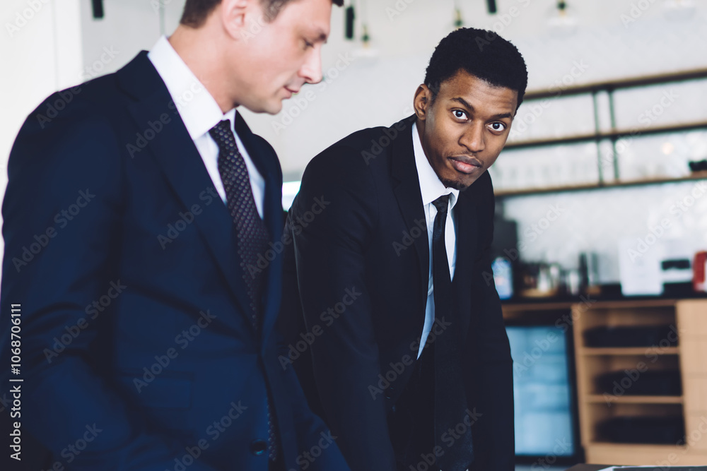 Group of men working in the modern office Group of men working in the modern office