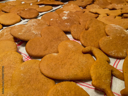 Different shapes of gingerbread cookies on a white kitchen towel. Christmas concept in a Swedish kitchen. photo