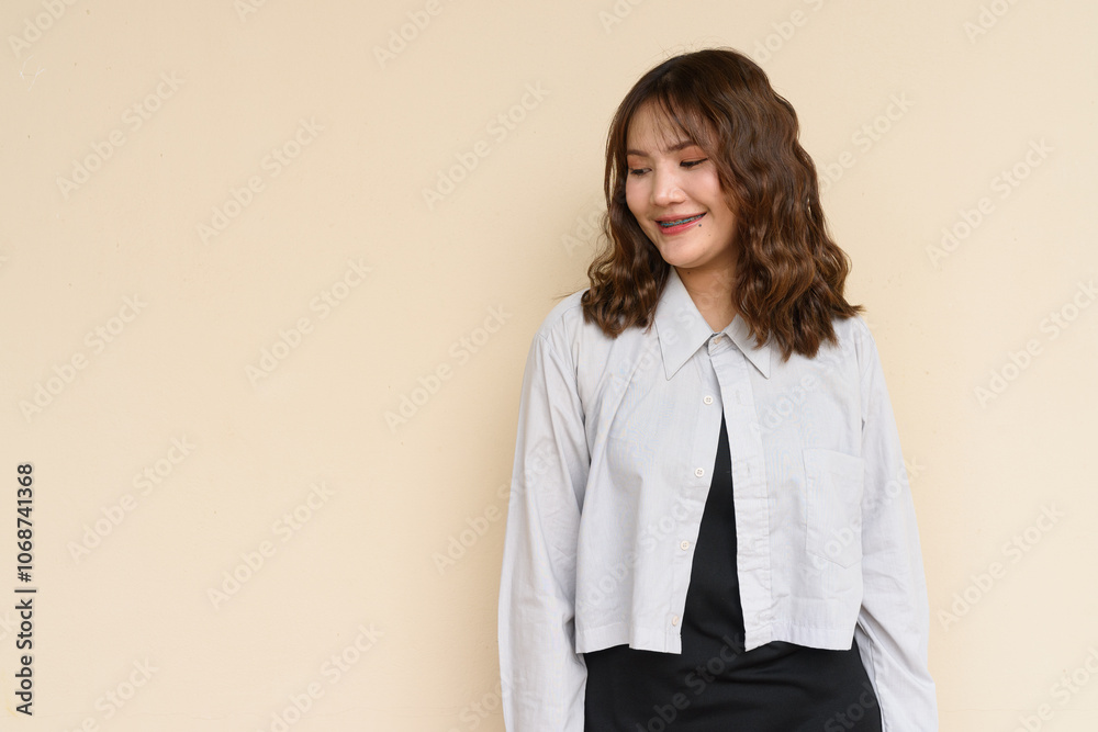 Portrait of Beautiful And Young Cute Asian Woman Against Plain Background Outdoors Portrait of Beautiful And Young Cute Asian Woman Against Plain Background Outdoors