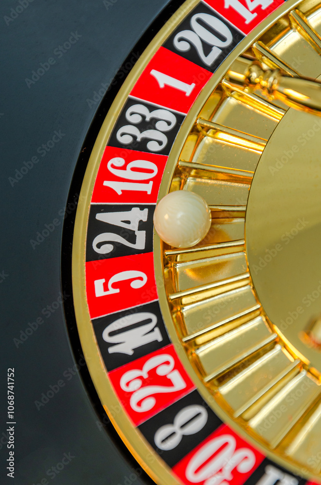 The roulette wheel spins in the casino The roulette wheel spins in the casino