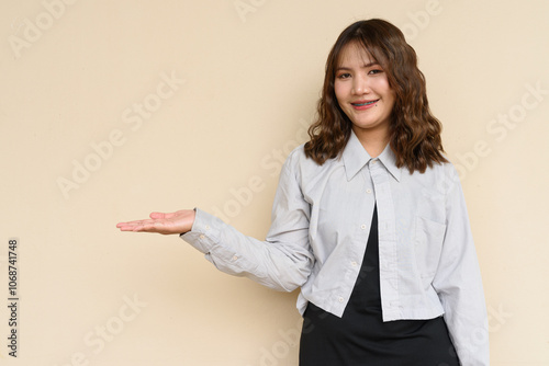 Portrait of Beautiful And Young Cute Asian Woman Against Plain Background Outdoors