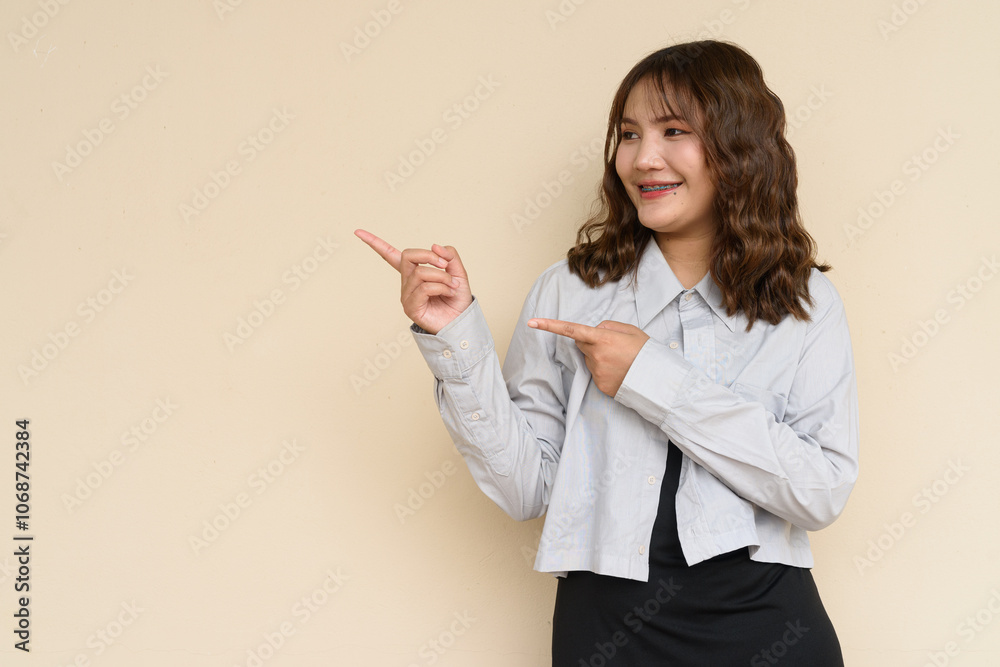 Portrait of Beautiful And Young Cute Asian Woman Against Plain Background Outdoors Portrait of Beautiful And Young Cute Asian Woman Against Plain Background Outdoors