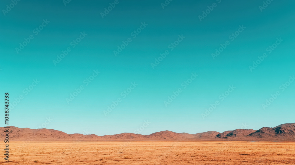 A serene desert landscape featuring a vast, arid land under a clear blue sky, with distant mountains creating a sense of depth. A serene desert landscape featuring a vast, arid land under a clear blue sky, with distant mountains creating a sense of depth.