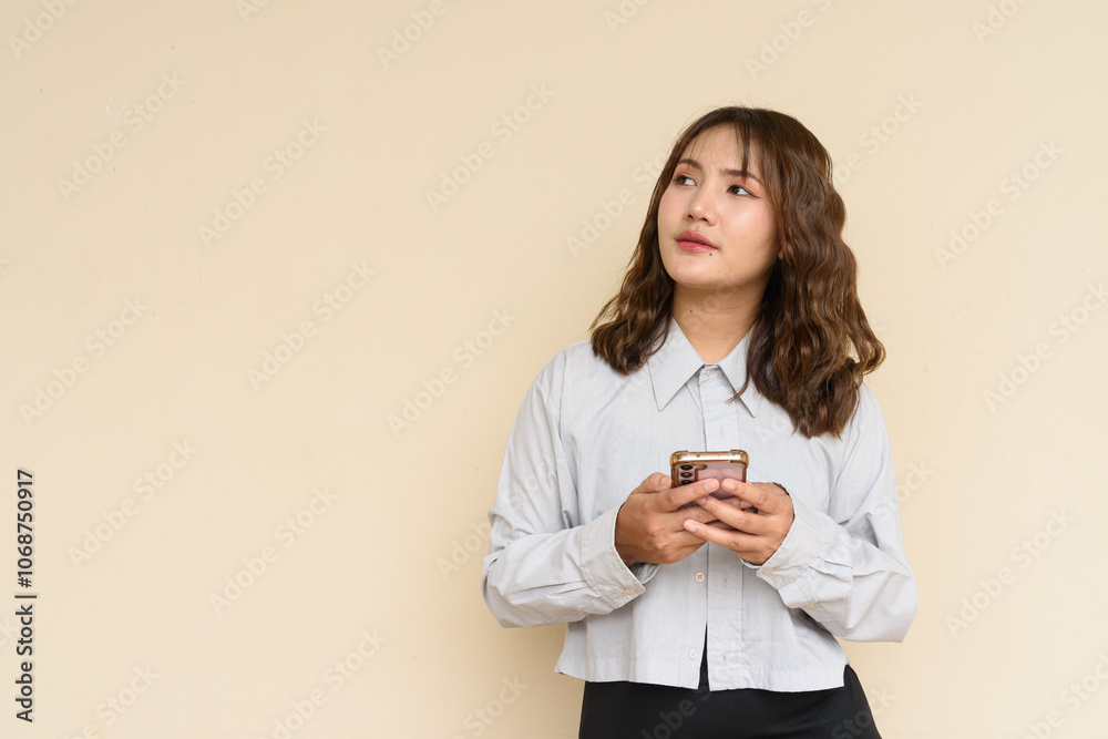 Portrait of Beautiful And Young Cute Asian Woman Against Plain Background Outdoors Portrait of Beautiful And Young Cute Asian Woman Against Plain Background Outdoors