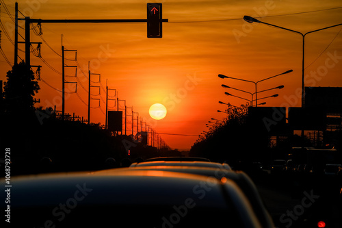 Sunset Above Traffic with Silhouetted Power Lines