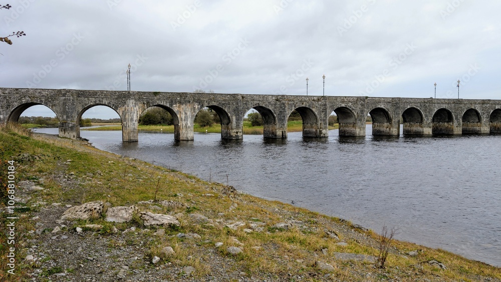 Old stone bridge over Shannon river At Shannonbridge, county Offaly, Ireland, historic landmark, nature background
