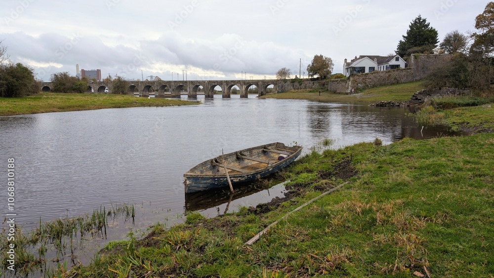 Old wooden fishing boat in river Shannon at Shannonbridge, Offaly, Ireland, nature background
