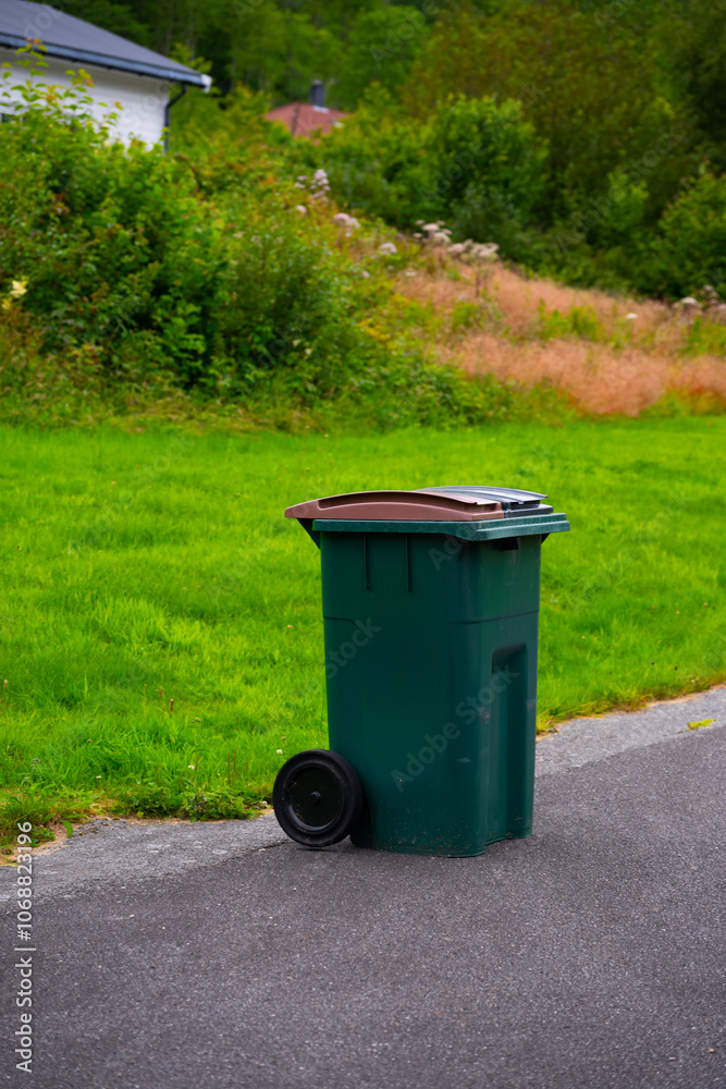 Green trash can with two separate chambers. Green trash can with two separate chambers.