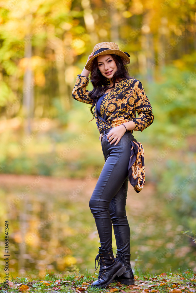 a beautiful woman sits on a log near a lake during autumn a beautiful woman sits on a log near a lake during autumn