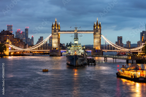 Vászonkép Tower Bridge and Belfast warship on Thames river at night, London, UK