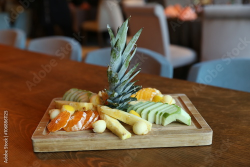 Obraz na płótnie A vibrant and colorful fruit platter with a pineapple centerpiece, perfect for a healthy and refreshing snack w salonie