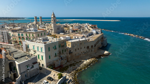 Aerial view of houses, apartments and buildings located in the old town of Molfetta, in the province of Bari, Puglia, Italy. 