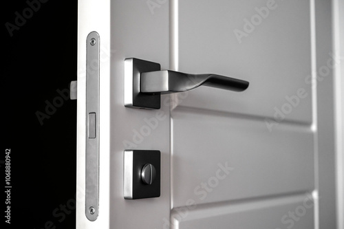 Mortise lock. White wooden door with magnetic lock.