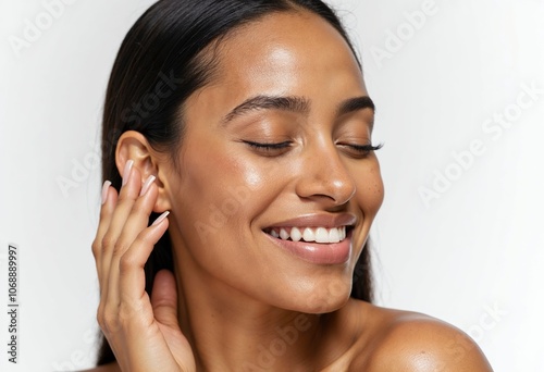 Elegant Woman Smiling with Clear Radiant Skin in Studio Shot