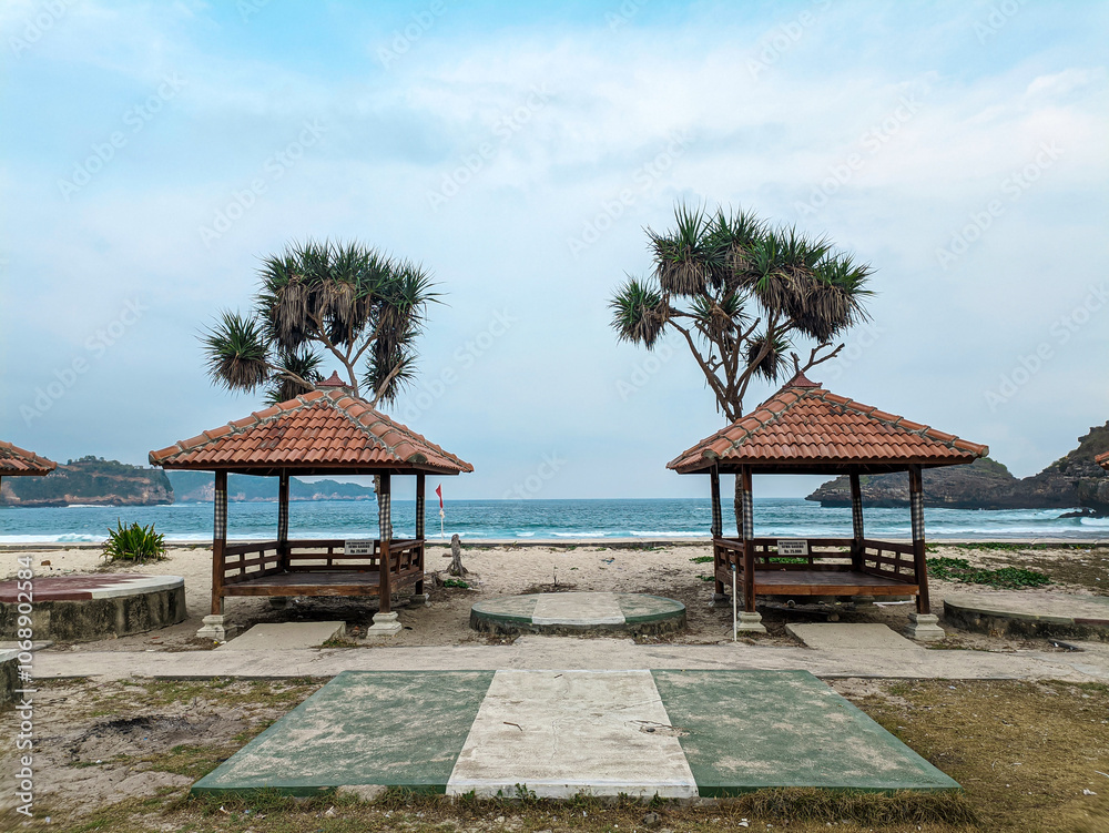 Wooden gazebo by the tropical beach. Summer vacation. Wooden gazebo by the tropical beach. Summer vacation.