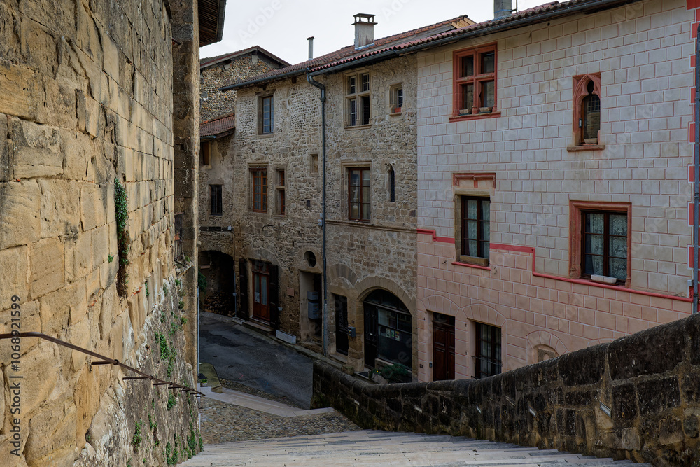 ST-ANTOINE-L'ABBAYE, FRANCE, November 5, 2024 : Main stairway and a street of the medieval village surrounding the Abbey of Saint-Antoine. ST-ANTOINE-L'ABBAYE, FRANCE, November 5, 2024 : Main stairway and a street of the medieval village surrounding the Abbey of Saint-Antoine.