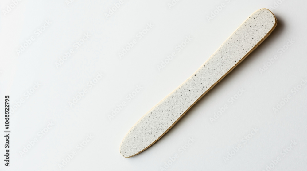 A white object with a black tip