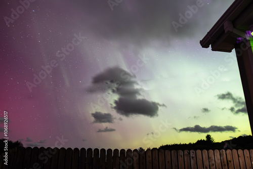 The Aurora Borealis, the northern lights, showing up above bungalow in County Donegal, Ireland photo