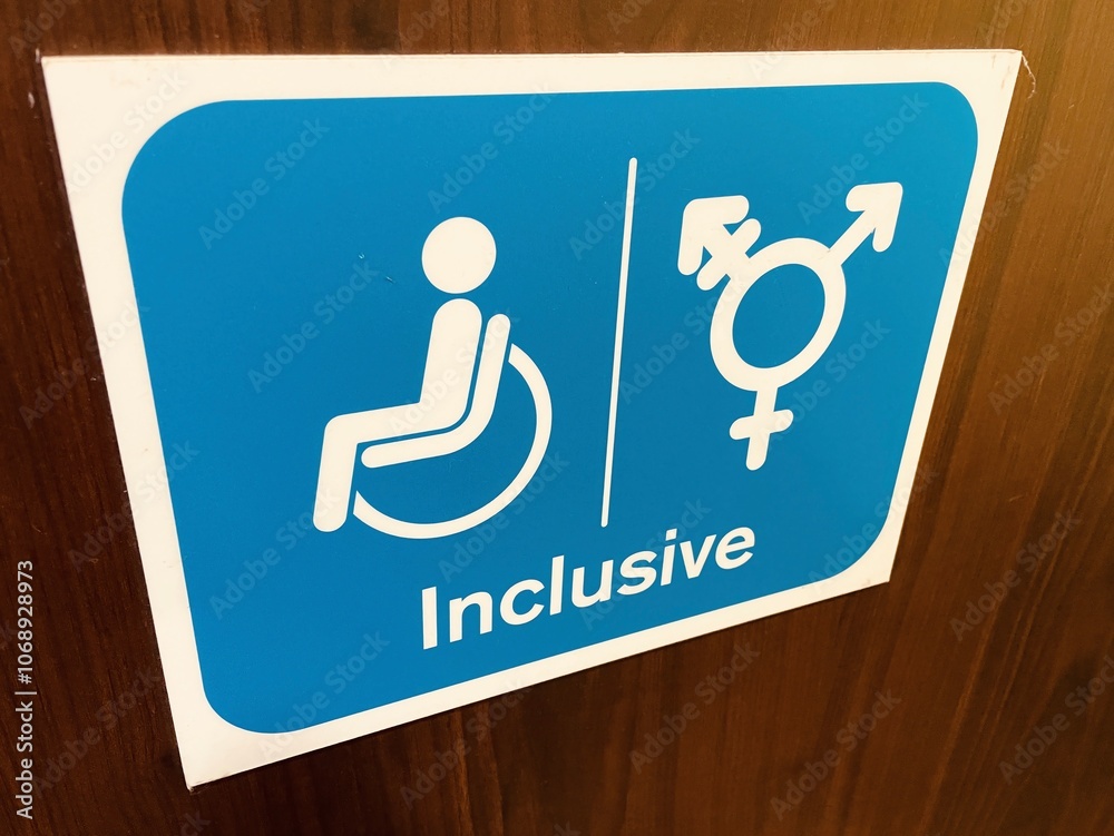 Inclusive signage on toilet door at motorway service station