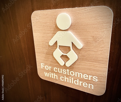 Baby changing signage on toilet door