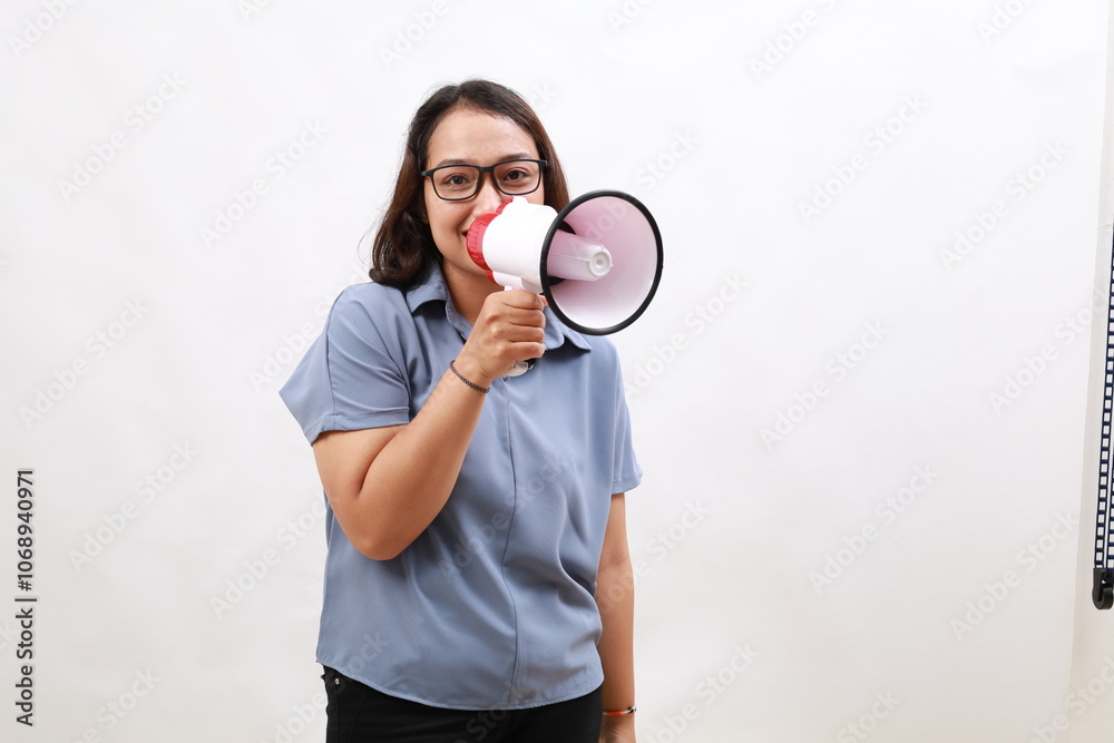 Happy smiling Young Asian woman holding megaphone isolated on white background, Speech and announce concept Happy smiling Young Asian woman holding megaphone isolated on white background, Speech and announce concept