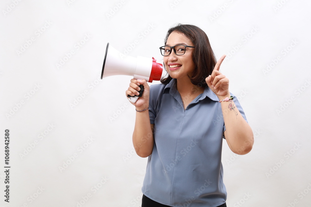 Young Asian girl with finger gesture pointing making announcement megaphone. Isolated on white Young Asian girl with finger gesture pointing making announcement megaphone. Isolated on white