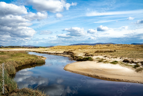 The stream that flows from Sheskinmore Nature Reserve to Ballinravey Strand between Ardara and Portnoo in Donegal - Ireland photo