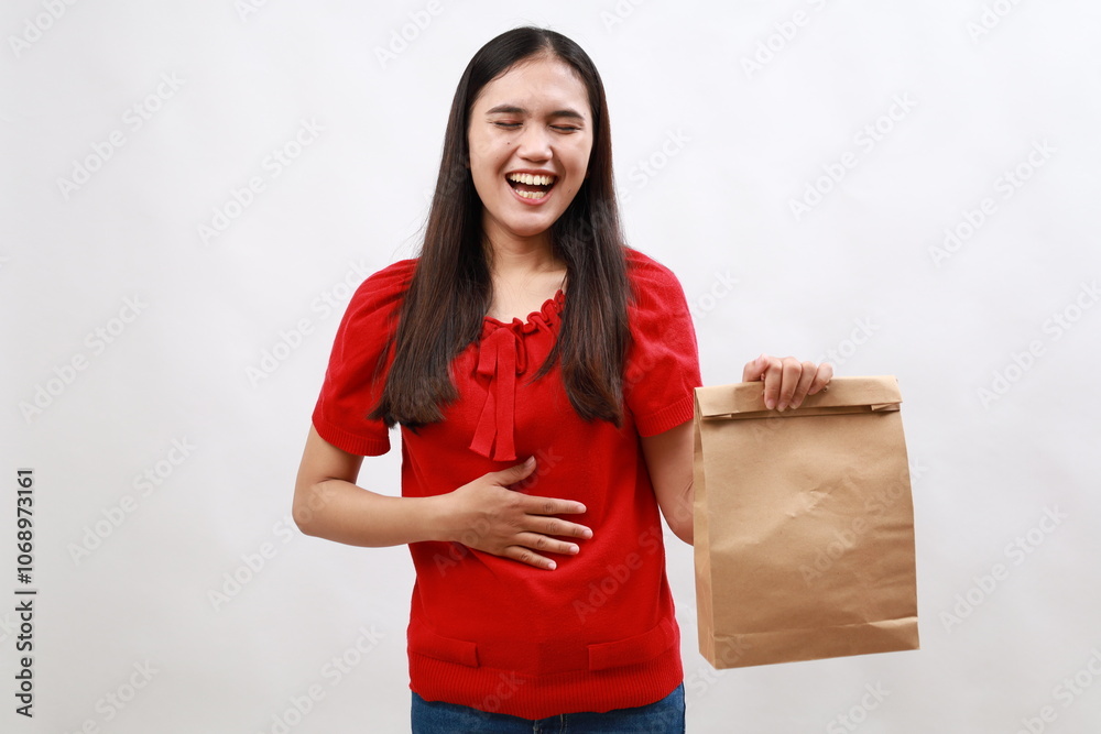 Young asian woman laughing out loud at some hilarious joke. take away concept