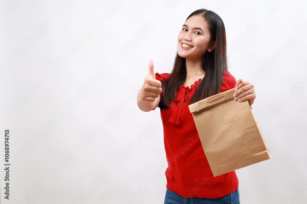 Pretty asian woman feeling proud,smiling positively with thumbs up. take away food concept Pretty asian woman feeling proud,smiling positively with thumbs up. take away food concept