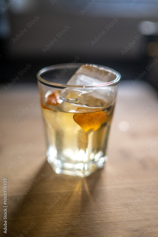 Refreshing Whiskey Cocktail with Orange Peel in Seville