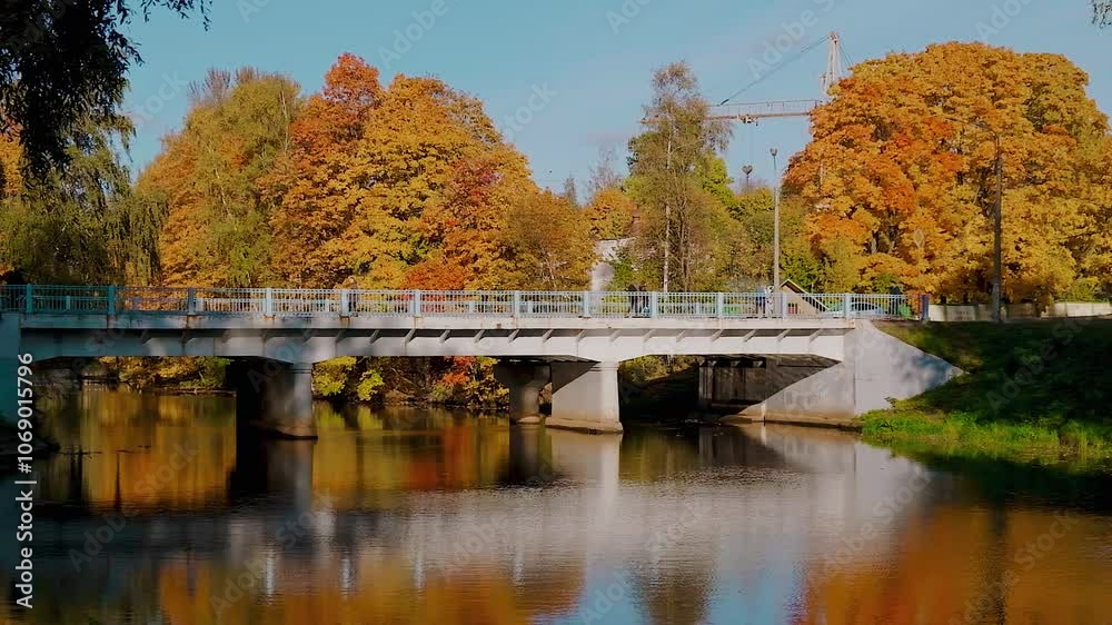 Beautiful autumn season in the park with a lake, red and yellow leaves on the trees. Beautiful autumn season in the park with a lake, red and yellow leaves on the trees.