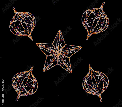 Ornate Christmas star and balls on a black background
