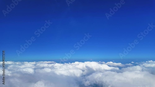 4K ime lapse, high view of Sea of clouds with beautifully blue sky.