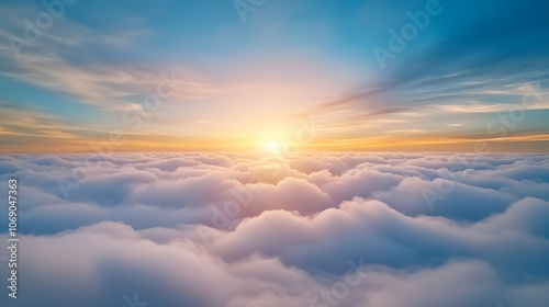 Beautiful sunset and cloudy sky from an aerial view. Airplane view above clouds