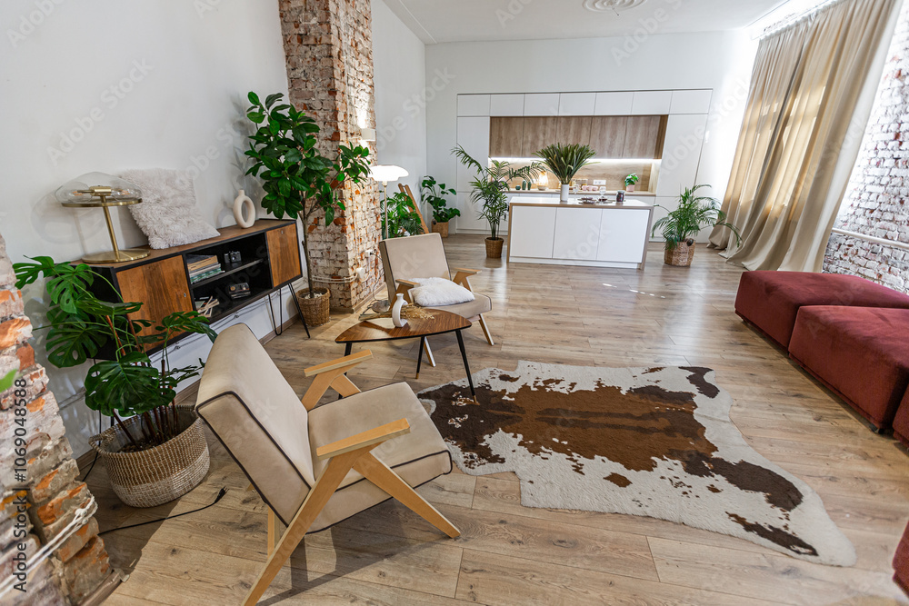 Fototapeta premium Bright and spacious living area featuring modern furniture and natural light in a stylish apartment in soft warm colors