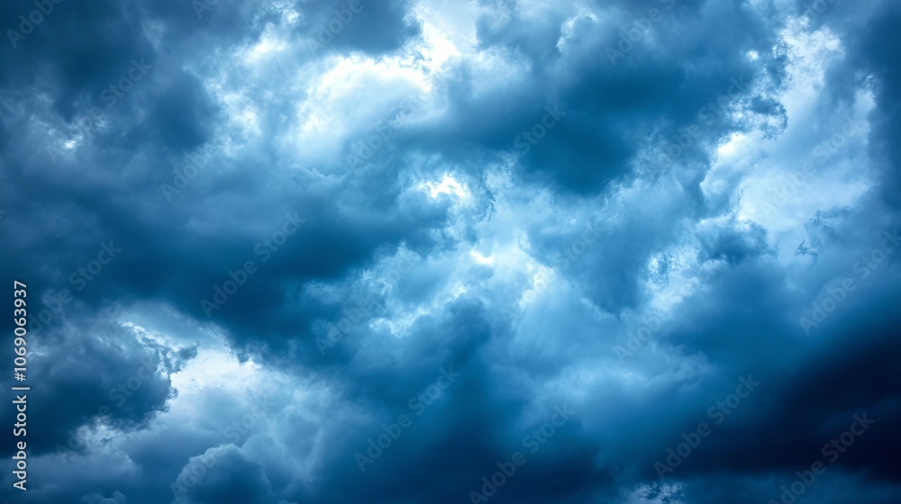 Dark, moody cloud fill the sky, suggesting an impending storm. Dark, moody cloud fill the sky, suggesting an impending storm.