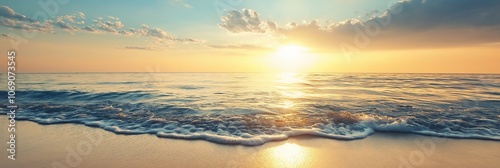 Waves gently wash ashore under a golden sunset, creating a serene atmosphere of peace and reflection by the sea. photo