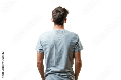 Young men in t shirt and jeans looking away.