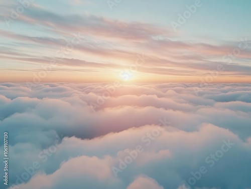 Wallpaper Mural aerial view above fluffy clouds at sunset, showcasing a breathtaking cloudscape with soft pink and blue hues blending together, evoking a sense of wonder and tranquility in nature Torontodigital.ca