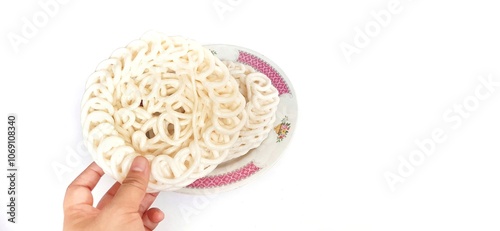 White noodle crackers or kerupuk putih or kerupuk warung made from tapioca flour, snack food from Indonesia isolated on white background photo