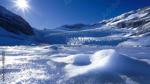 A majestic glacier showcases sparkling ice and deep crevasses beneath a bright blue sky, highlighting the dramatic and pristine beauty of icy landscapes. photo