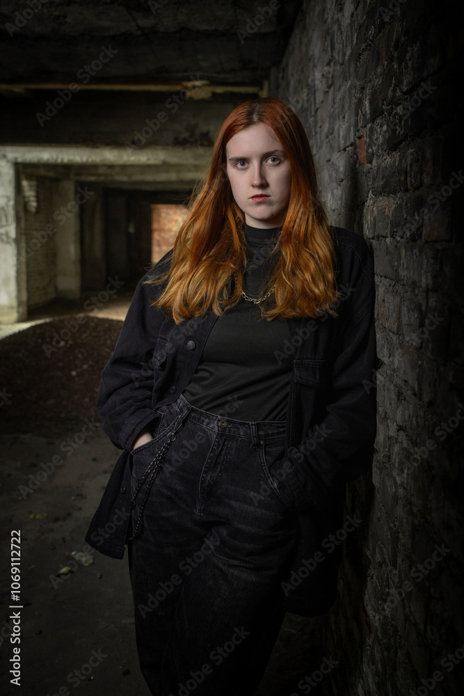 Studio portrait of a young beautiful red-haired girl. Studio portrait of a young beautiful red-haired girl.