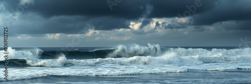 Large waves crash against the shore under a stormy sky